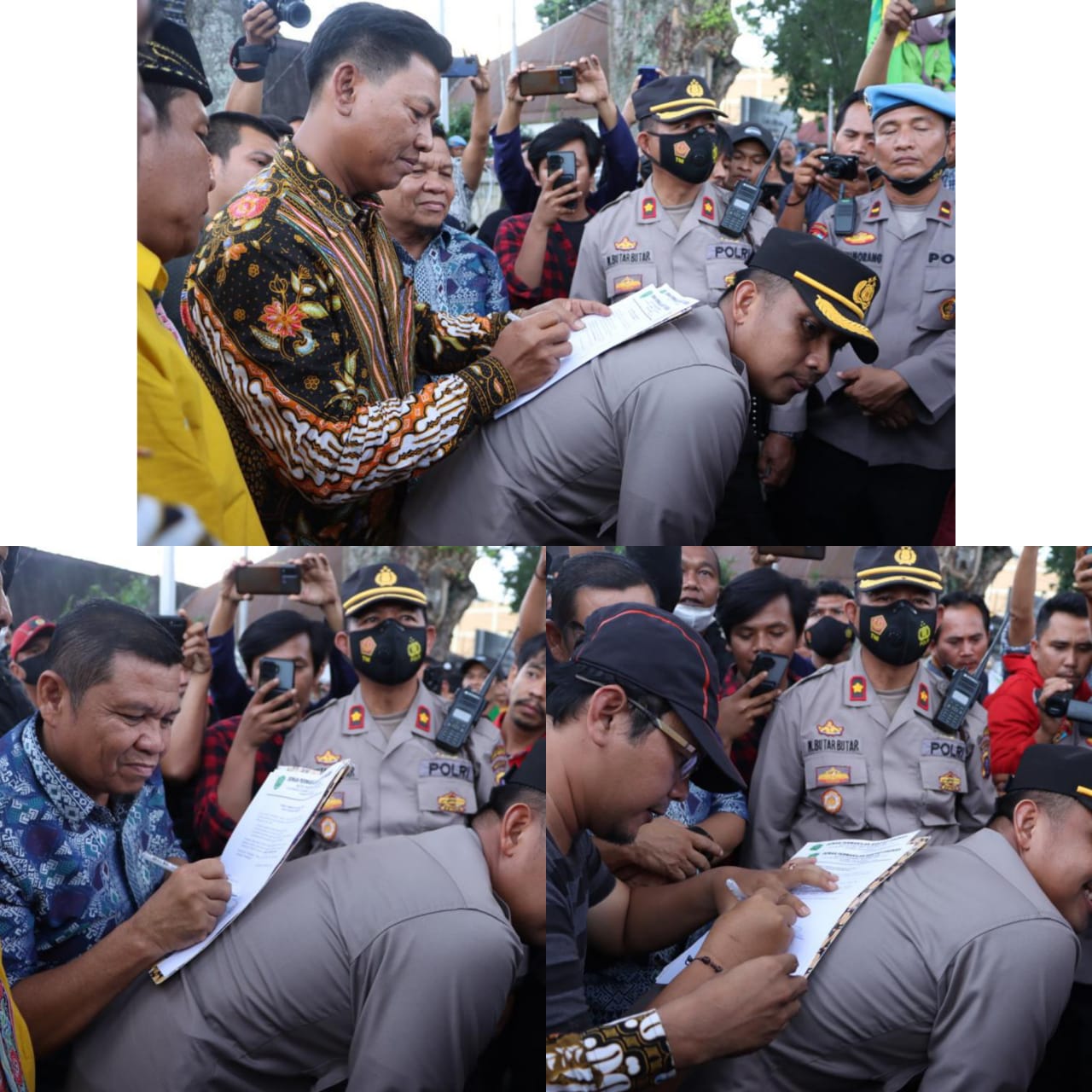 Aksi Simpatik Kapolres Tapsel yang Relakan Punggungnya Dijadikan Landasan Tandatangan di Tengah Seribuan Pendemo