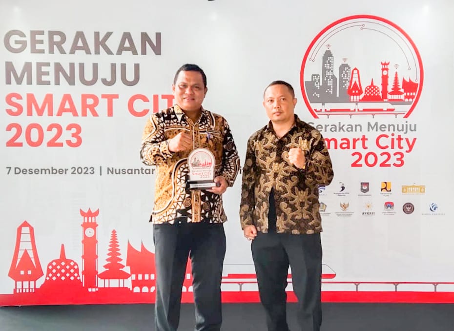 Kadiskominfo Johannes Sihombing SSTP MSi menghadiri acara Forum Smart City Nasional